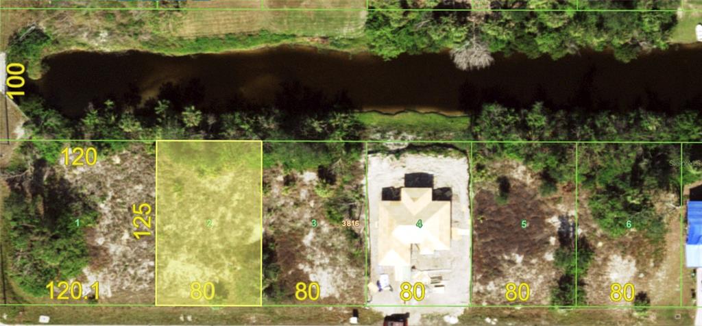 An aerial map shows a highlighted vacant residential lot next to a house under construction — 12020 XAVIER AVENUE, PORT CHARLOTTE, FL