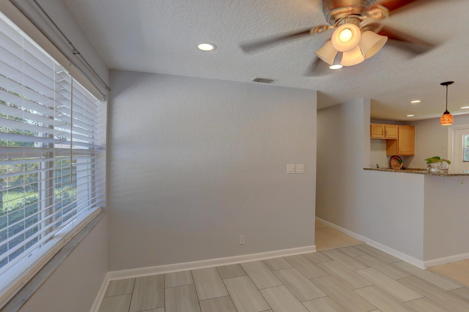 A dining area with light gray walls, tile flooring, a ceiling fan, and window blinds — 314 NW 12th Avenue, Delray Beach FL 33444, DELRAY BEACH, FL