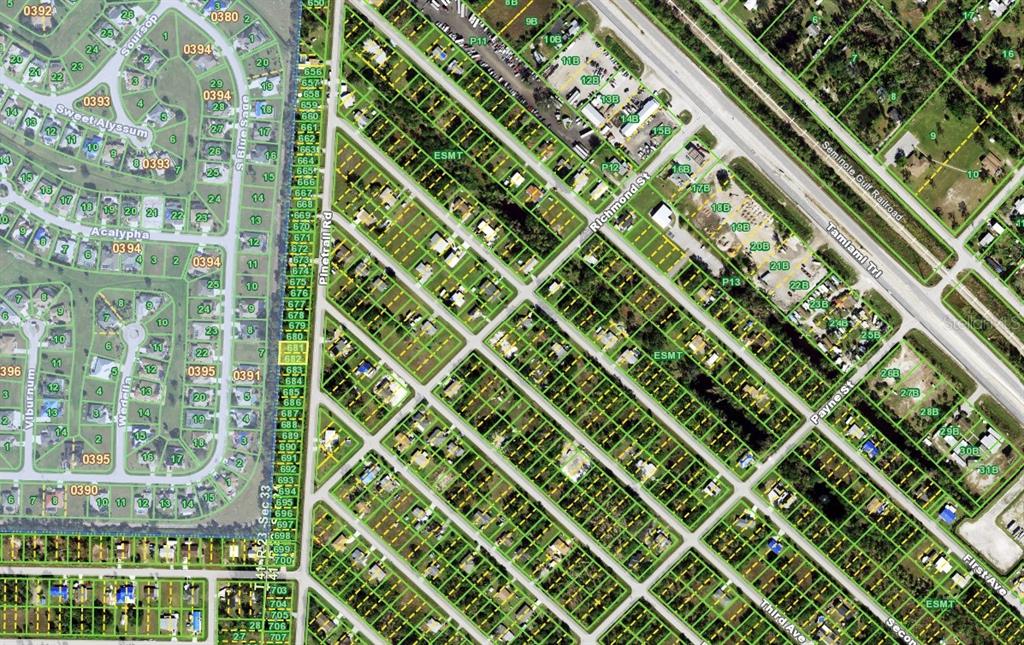 This is an aerial map showing residential lots, streets, and surrounding infrastructure — 11197 / 11205 PINETRAIL ROAD, PUNTA GORDA, FL