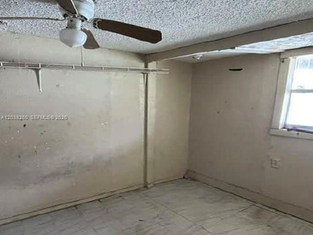 An empty room with a ceiling fan, a wire closet shelf, and a window — 314 S 17th St, Fort Pierce FL 34950, FORT PIERCE, FL