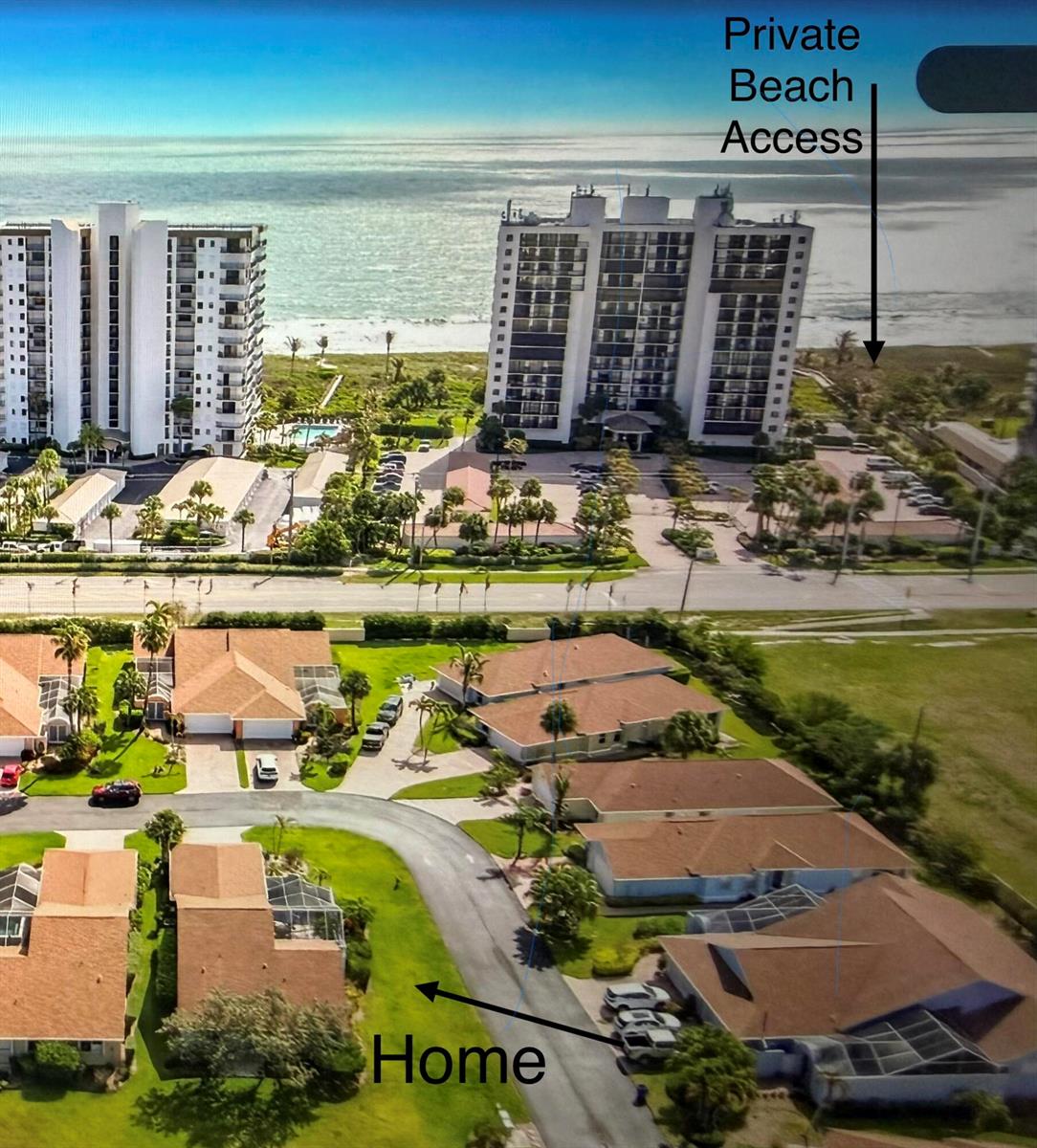 An aerial view shows a residential neighborhood with a private beach access path nearby — 208 River Walk, Fort Pierce FL 34949, FORT PIERCE, FL