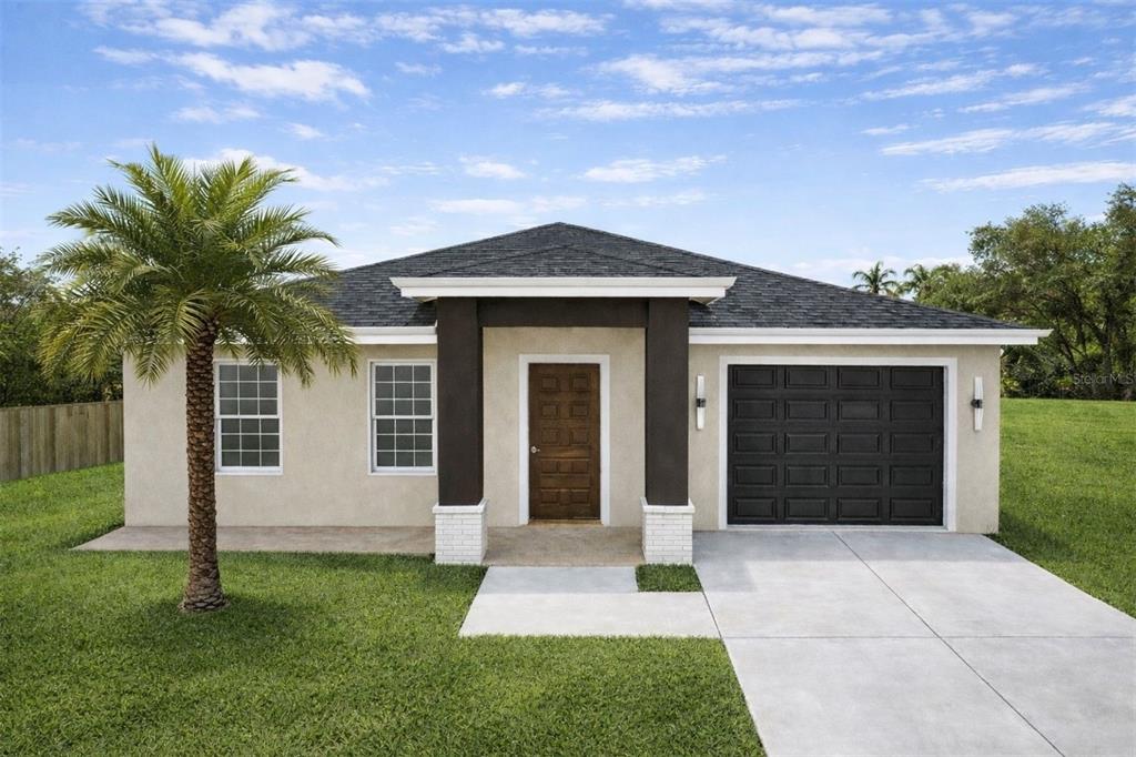 A kitchen with white cabinets and a breakfast bar opens into a living area — 2017 E SEWARD STREET, TAMPA, FL
