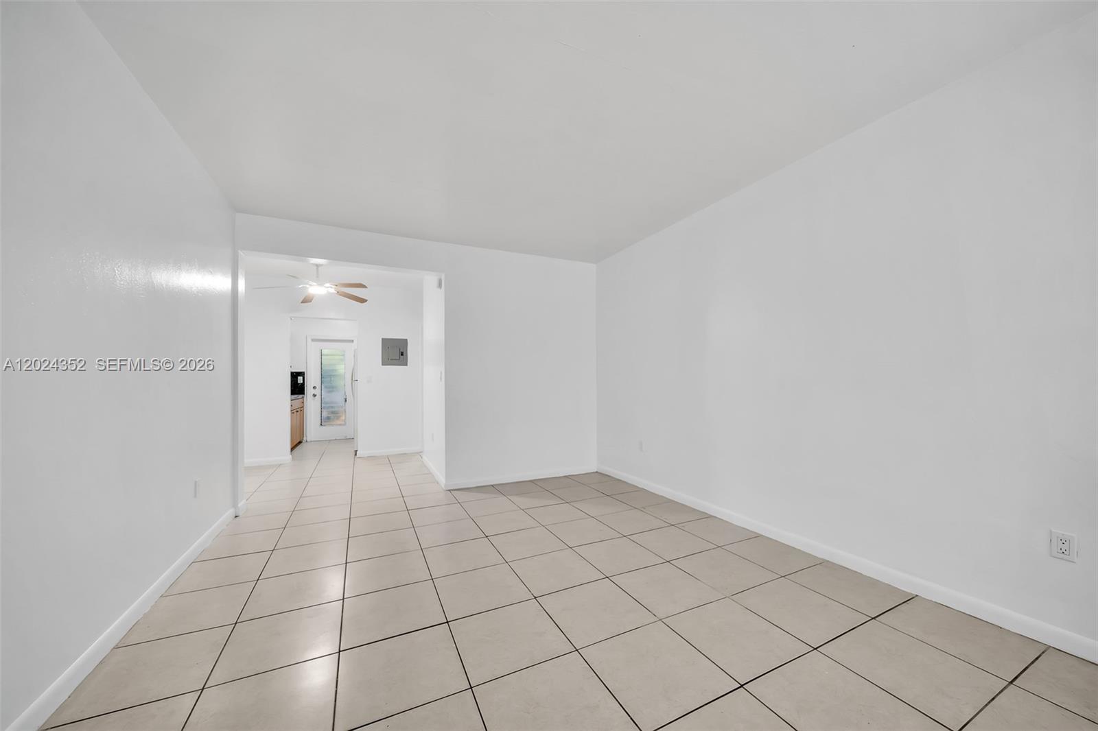 An empty room with white walls and light-colored square floor tiles — 934 Meridian Ave # 7, Miami Beach FL 33139, MIAMI BEACH, FL