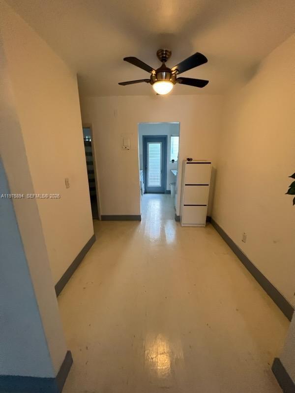 A narrow room with light-colored flooring, a ceiling fan, and a white storage cabinet — 761 Euclid Ave # 12B, Miami Beach FL 33139, MIAMI BEACH, FL