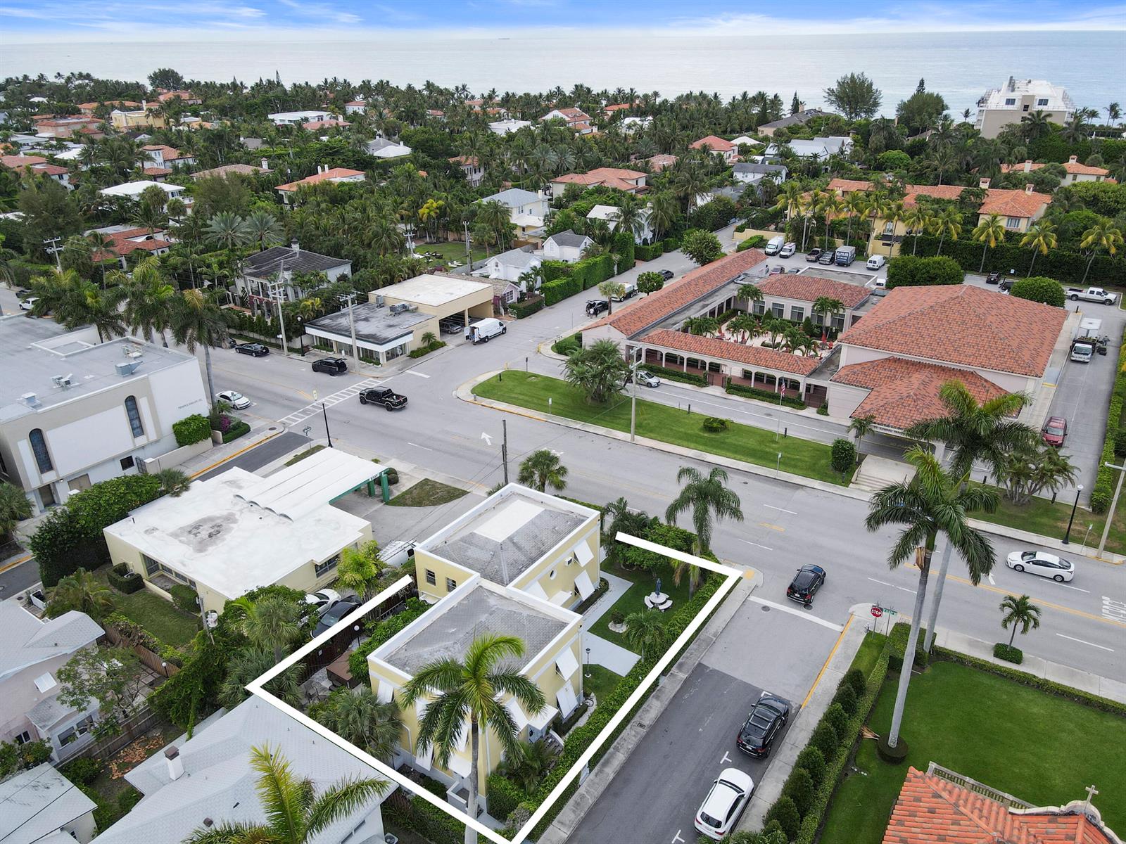 An aerial view shows a yellow residential building with a flat roof and palm trees — 172 N County Road, Palm Beach FL 33480, PALM BEACH, FL