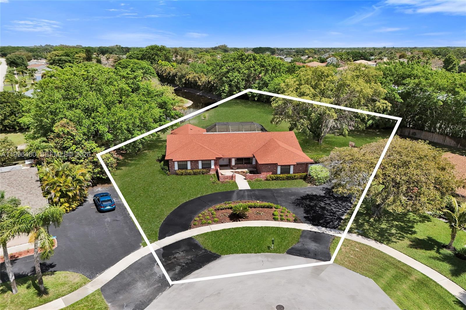 An aerial view shows a brick house with a red roof and a circular driveway — 18428 S 102nd Way S, Boca Raton FL 33498, BOCA RATON, FL