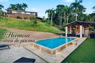 An outdoor swimming pool with a stone deck and a covered patio area — Cofresi MAMEYES UNIT 57, LUQUILLO, PR