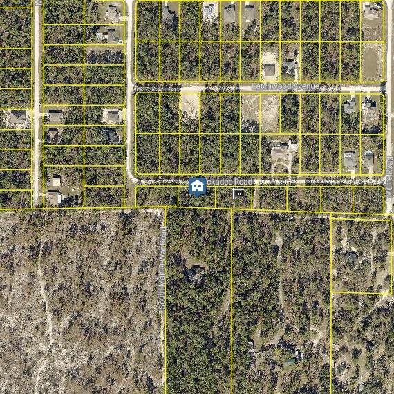 This is an aerial map showing residential lots, wooded areas, and roads — Lot 2 CHICKADEE ROAD, BROOKSVILLE, FL