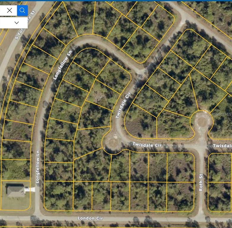 This is a satellite map showing residential lots and streets in a wooded neighborhood — LONGFELLOW LANE, NORTH PORT, FL