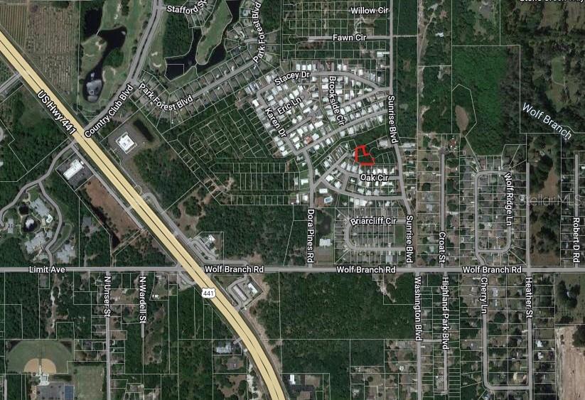 This is an aerial map showing a highlighted residential lot in a suburban neighborhood — 2128 SUPREME COURT, MOUNT DORA, FL
