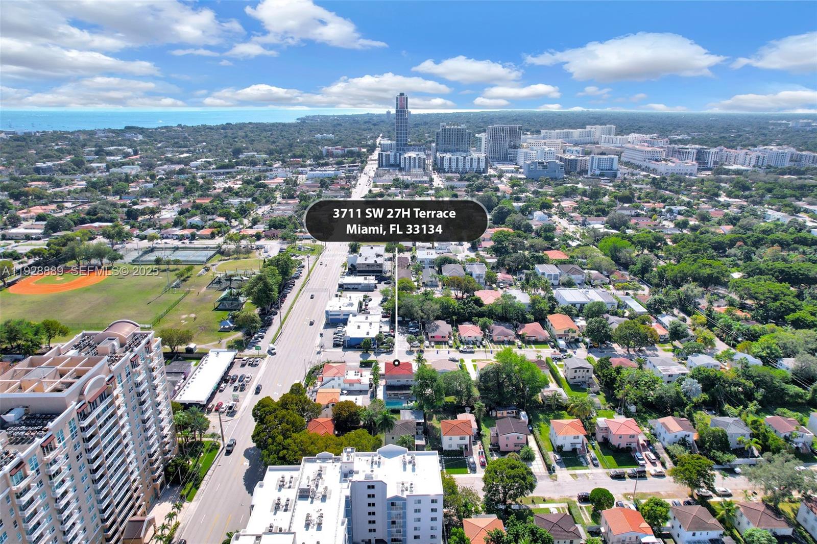 An aerial view shows a residential neighborhood in Miami with a highlighted property — 3711 SW 27th Ter, Miami FL 33134, MIAMI, FL