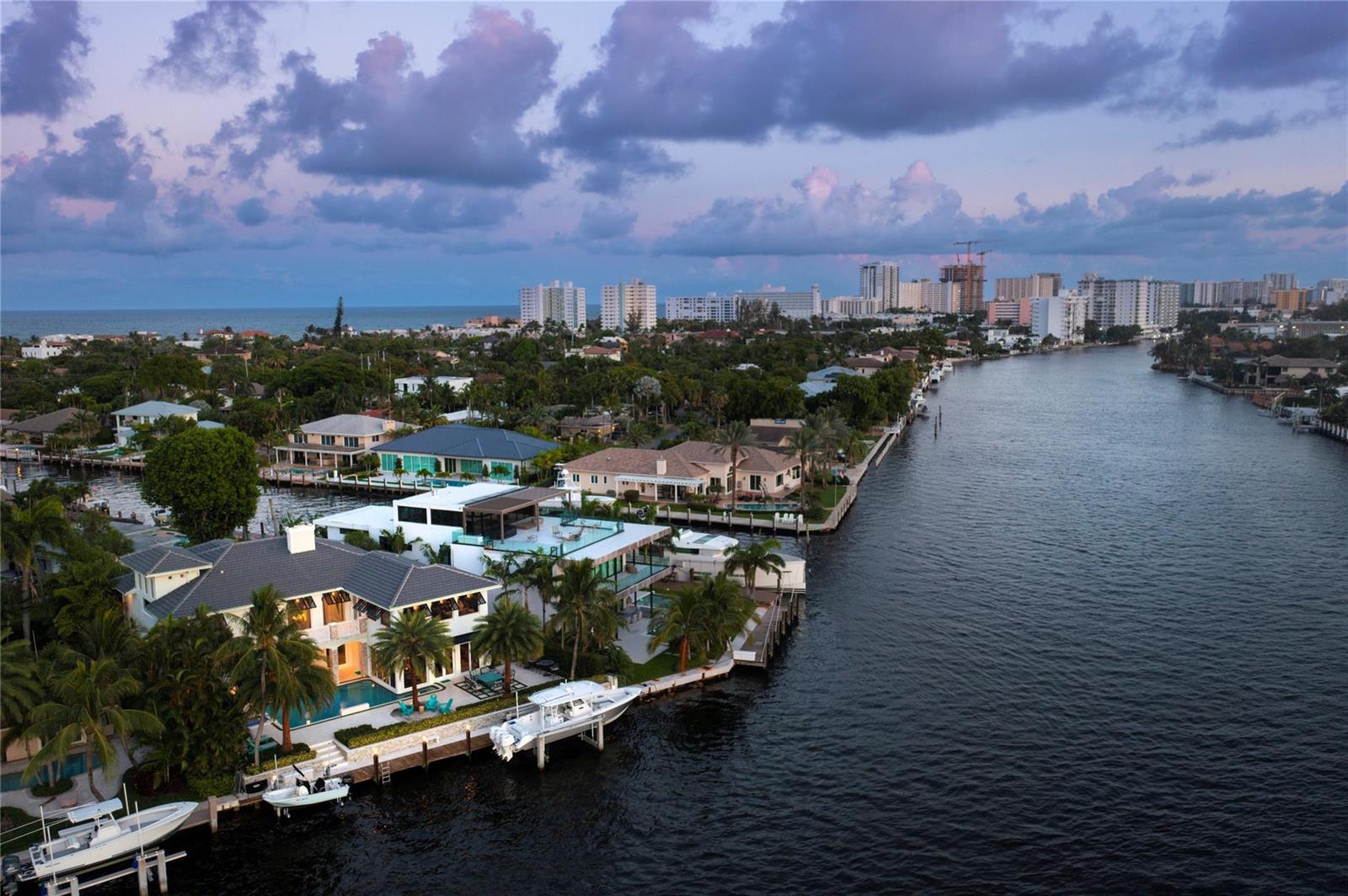 An aerial view of waterfront luxury homes with private docks and boats along a canal — 2307 N Riverside Drive, Pompano Beach FL 33062, POMPANO BEACH, FL
