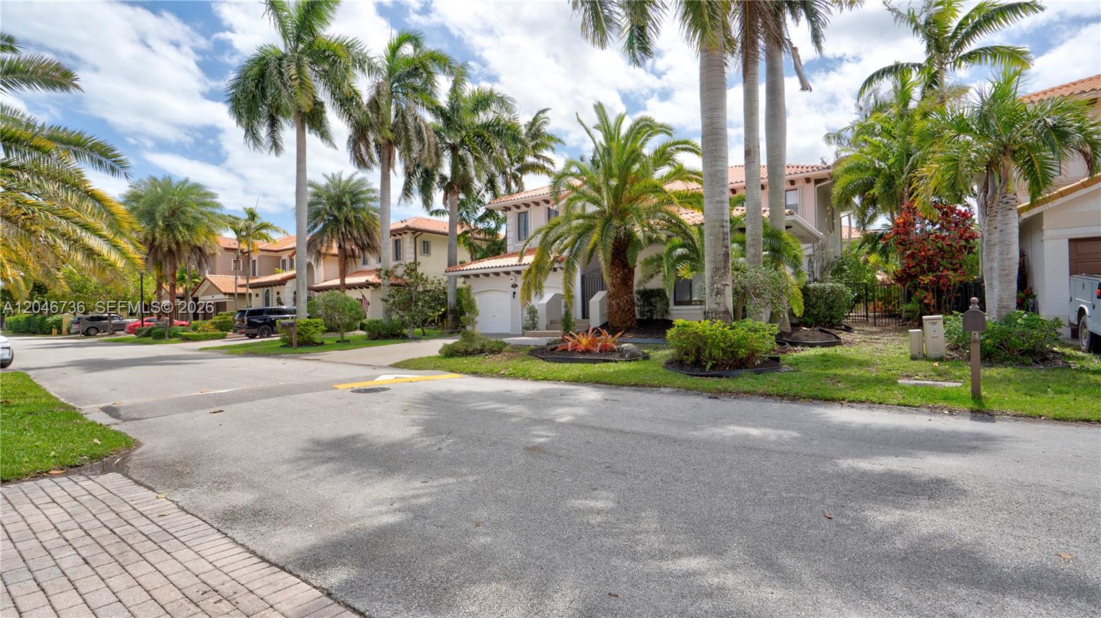 A two-story residential house with a tile roof and palm trees in the front yard — 7956 SW 195th St, Cutler Bay FL 33157, CUTLER BAY, FL
