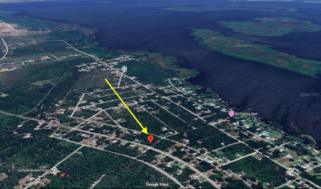 This is an aerial map view showing a residential area near a large lake — 427 WASHINGTON BOULEVARD, LAKE PLACID, FL