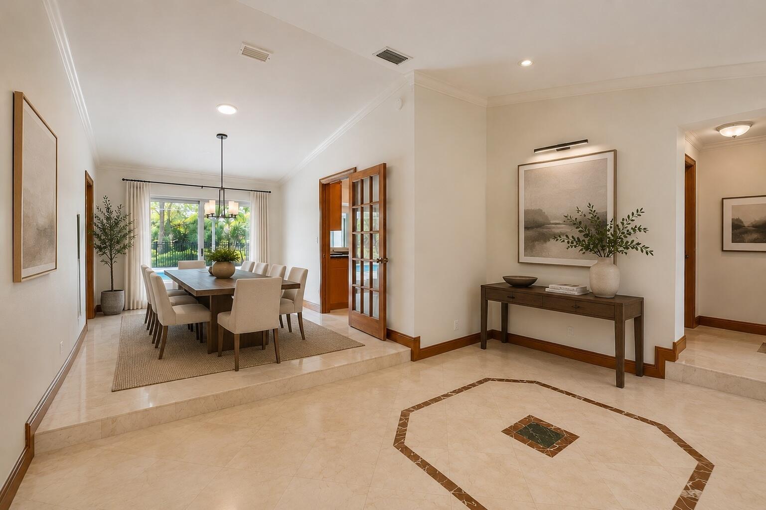 A dining room with a table and chairs sits on a raised platform near an entryway — 2334 Timbercreek Circle NW, Boca Raton FL 33431, BOCA RATON, FL