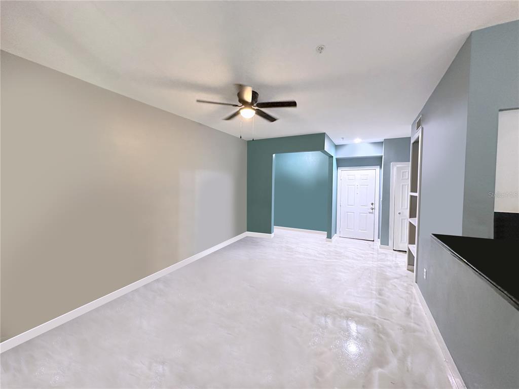 A black front door with the number 1113 is set in a light green stucco wall — 1810 E PALM AVENUE UNIT 1113, TAMPA, FL