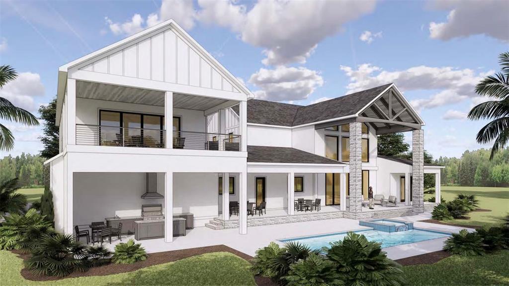 A spacious living room features a stone fireplace, light wood floors, and a staircase — 655 APPALOOSA ROAD, TARPON SPRINGS, FL