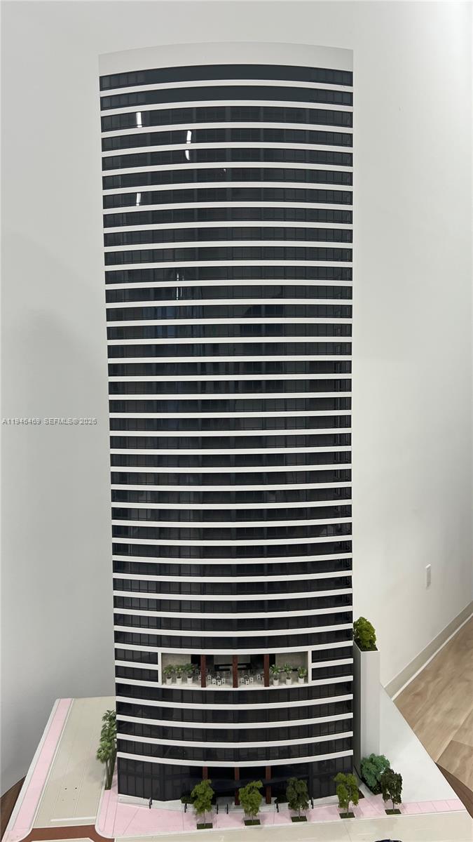 This is an architectural scale model of a tall, cylindrical high-rise building — 225 N Miami Ave # 905, Miami FL 33128, MIAMI, FL