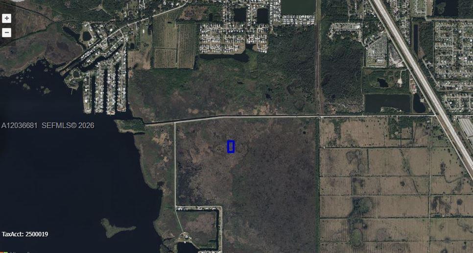 This aerial map shows a vacant, undeveloped plot of land highlighted by a blue rectangle — 0 UNKNOWN, Cocoa FL 32926, COCOA, FL
