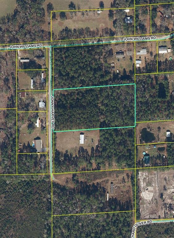 This is an aerial map showing a rectangular parcel of land outlined in teal — 0000 JOHN HARVEY ROAD, SANDERSON, FL