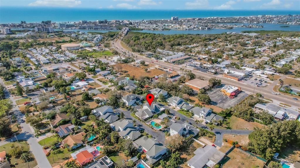 An aerial view shows a residential neighborhood with a red location pin over a house — 11722 CURRIE LANE UNIT F2, LARGO, FL