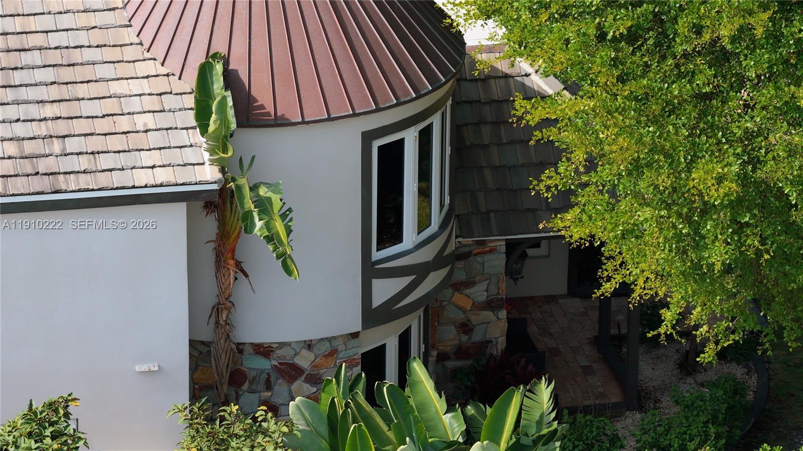 A single-story house with a stone facade, a turret, and a large front lawn — 3414 Norfolk St, Pompano Beach FL 33062, POMPANO BEACH, FL