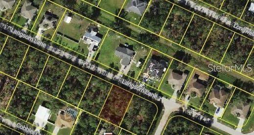 This aerial map shows a vacant residential lot surrounded by houses on a suburban street — LANGSOM LANE, NORTH PORT, FL