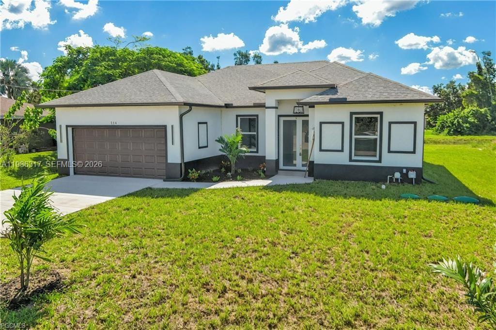 A single-story house with a brown garage door, white stucco walls, and a gray roof — 114 PRESTON ST, Lehigh Acres FL 33974, LEHIGH ACRES, FL