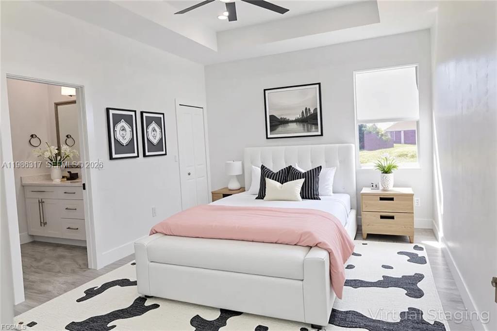 A bedroom with a white upholstered bed, pink throw, and cow-print rug features virtual staging — 114 PRESTON ST, Lehigh Acres FL 33974, LEHIGH ACRES, FL