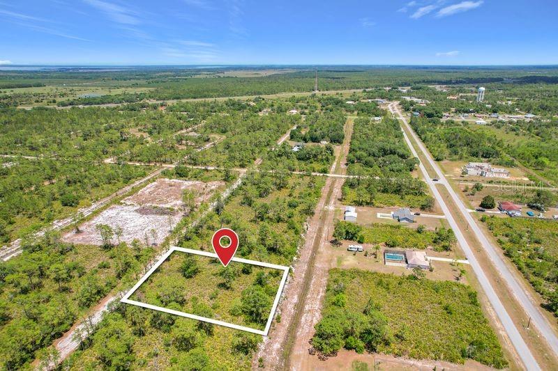 An aerial view shows a rectangular vacant lot outlined in white with a location pin — 0 EL DORADO DRIVE, INDIAN LAKE ESTATES, FL