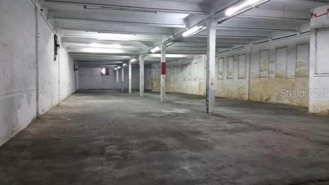An empty, industrial-style warehouse space with concrete floors, white walls, and exposed ceiling beams — Constitucion Ave INT PR-27, SAN JUAN, PR