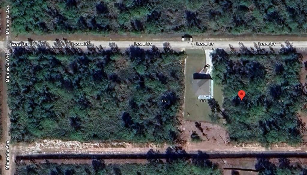 This aerial map shows a residential lot with a house and surrounding wooded area — 413 AZALEA DRIVE, INDIAN LAKE ESTATES, FL