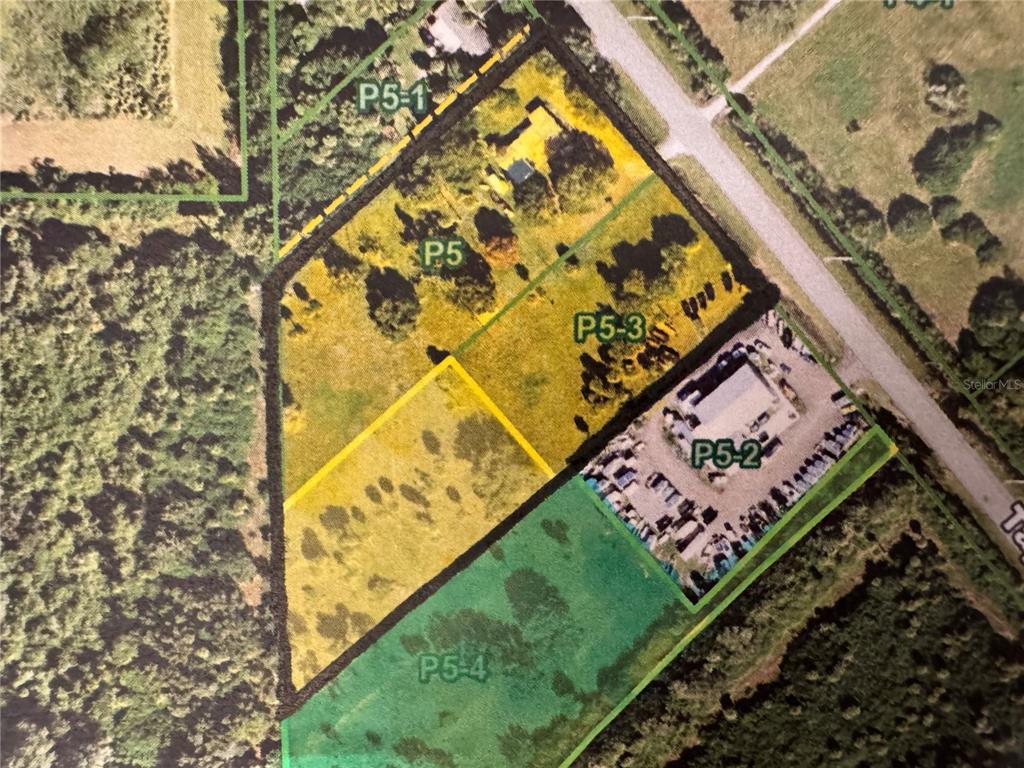 This is an aerial map showing several land parcels outlined in yellow and green — 2739 TAYLOR ROAD, PUNTA GORDA, FL