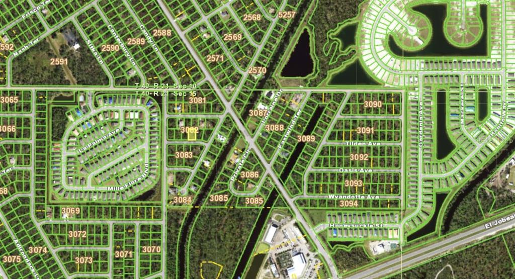 This is an aerial map showing residential streets, undeveloped lots, and water features — 15300 CASTO AVENUE, PORT CHARLOTTE, FL