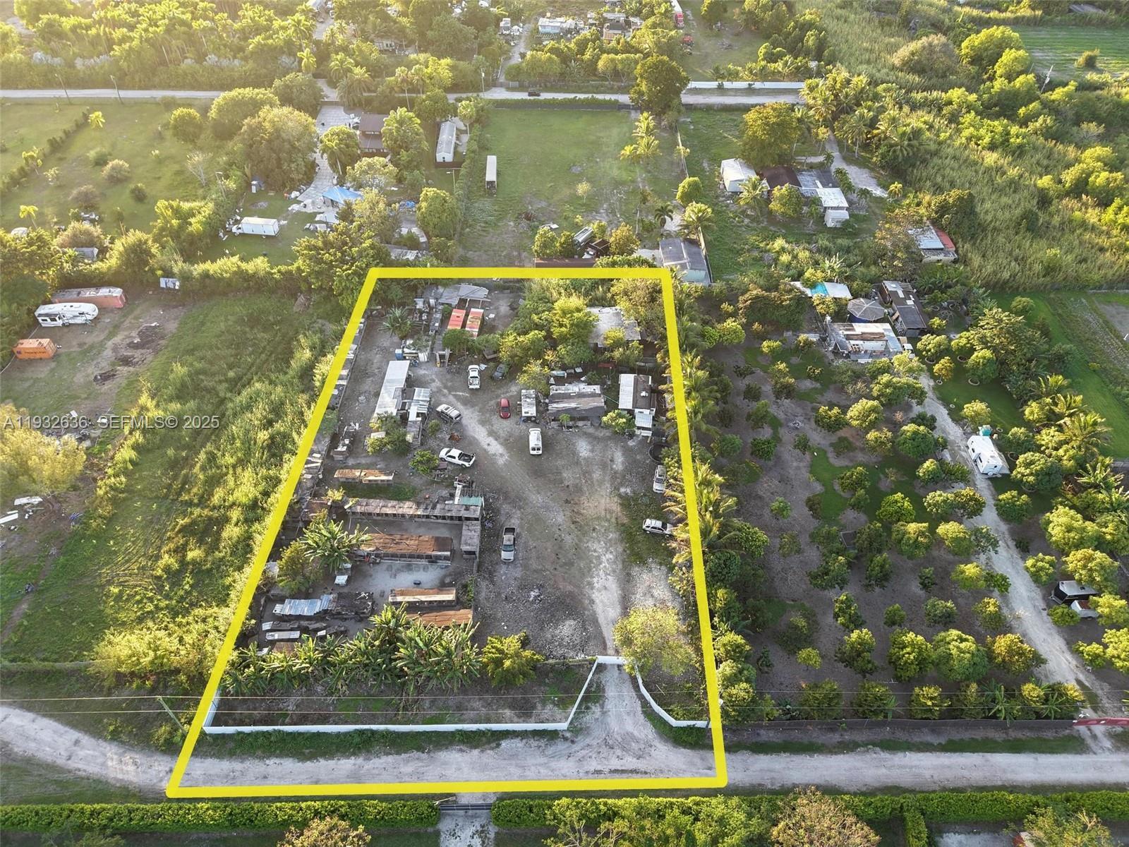 An aerial view shows a rectangular lot with several structures, vehicles, and trees — 15400 SW 207th ave, Miami FL 33187, MIAMI, FL