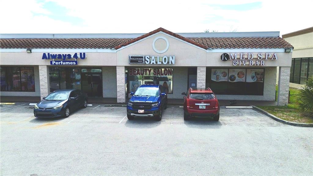 A strip mall storefront features a perfume shop, a beauty salon, and a medical spa — 11601 S ORANGE BLOSSOM TRAIL UNIT 108, ORLANDO, FL