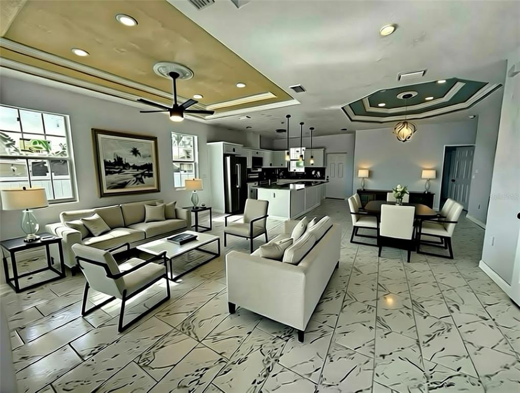 An open-concept living and dining area features white tile flooring, tray ceilings, and modern furniture — 4205 57TH AVENUE N, ST PETERSBURG, FL