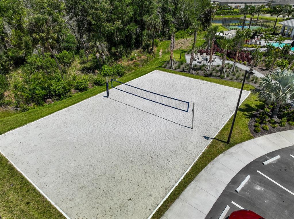An aerial view of a sand volleyball court located next to a parking lot — 5744 HAVEN TERRACE TERRACE, NOKOMIS, FL