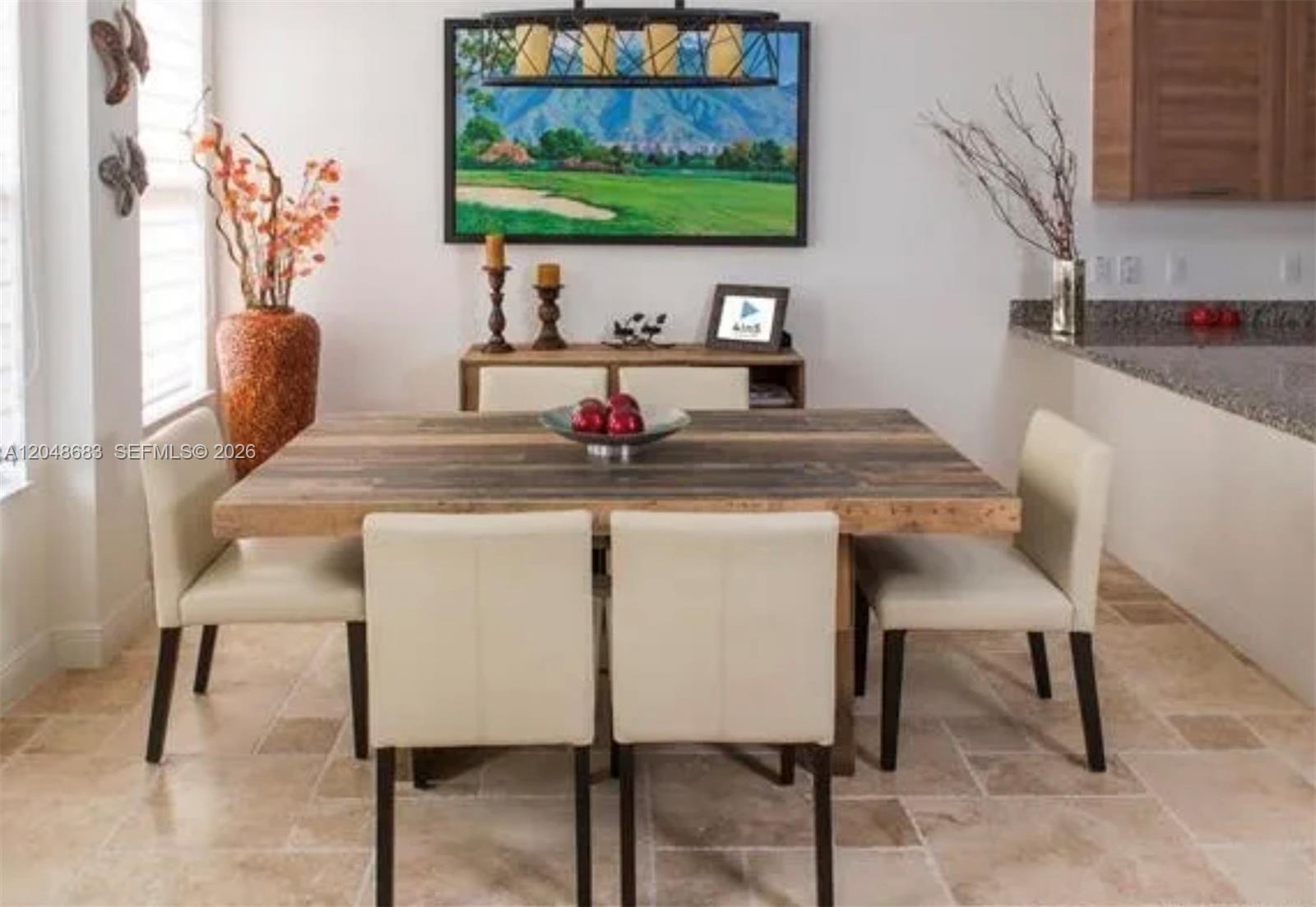 A dining room features a wooden table, four cream chairs, and a landscape wall painting — 5184 NW 84th Ave, Doral FL 33166, DORAL, FL