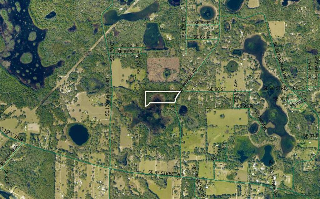 This is an aerial map showing a highlighted parcel of land surrounded by rural terrain — 9022 SE 180TH AVENUE ROAD, OCKLAWAHA, FL