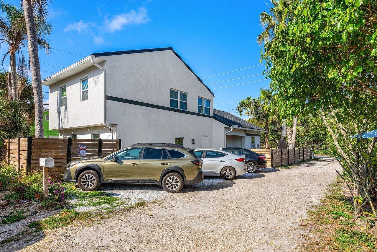 A two-story house with a gravel driveway and three parked cars in front — 4603 N Ocean Boulevard, Boynton Beach FL 33435, BOYNTON BEACH, FL