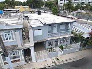 An elevated exterior view of a two-story gray house with a flat roof and balconies — 1006 JOSE GANDARA UNIT 6, SAN JUAN, PR