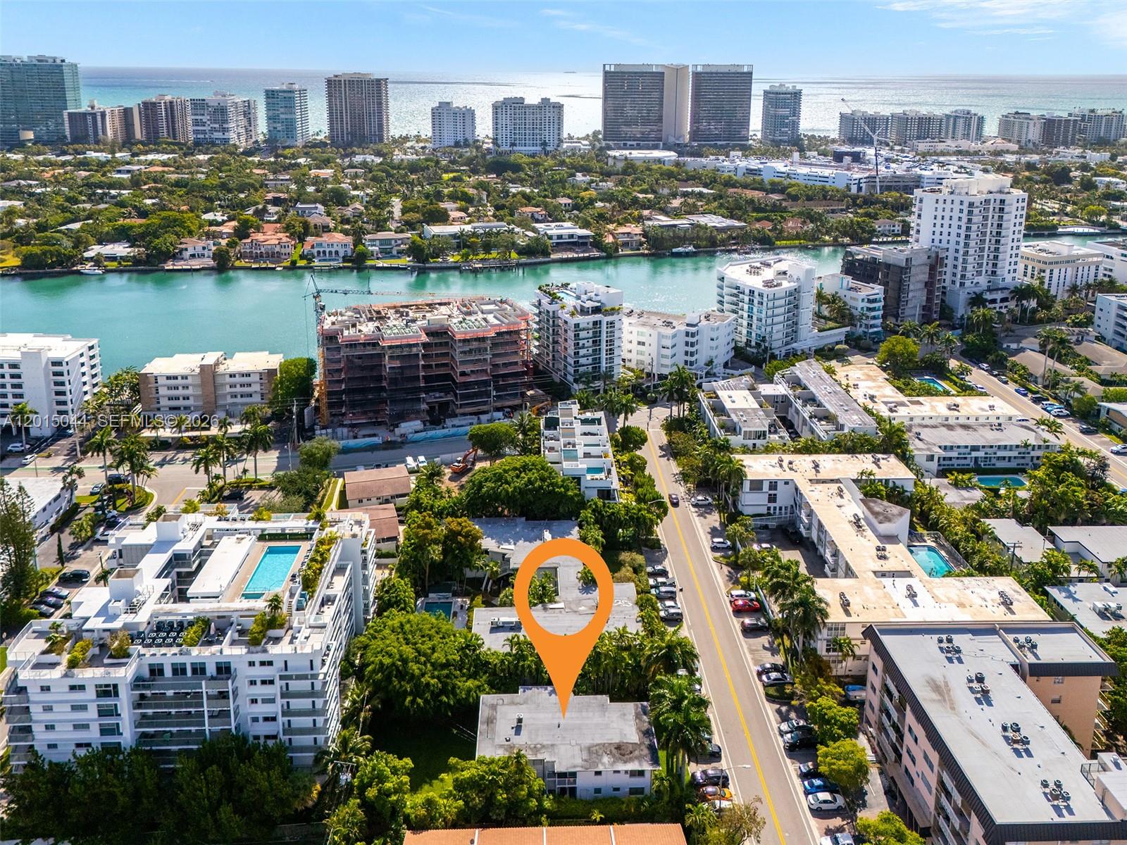 An aerial view shows a multi-story building marked with an orange pin near a waterway — 1125 99th St # 9, Bay Harbor Islands FL 33154, BAY HARBOR ISLANDS, FL