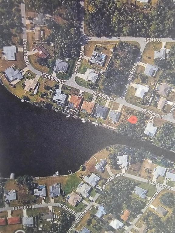 This is an aerial map view of a residential neighborhood bordering a canal — 458 LOMOND DRIVE, PORT CHARLOTTE, FL