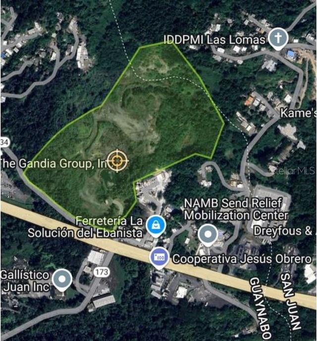 This is an aerial map view showing a large, undeveloped plot of land outlined in green — FELIPE LA VOZ RODRIGUEZ, GUAYNABO, PR