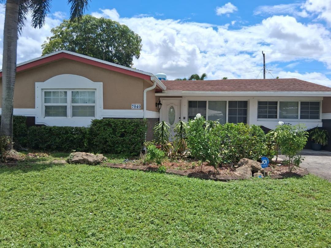 A single-story house with a tan exterior, white trim, and a brown shingled roof — 7040 SW 29th Street, Miramar FL 33023, MIRAMAR, FL