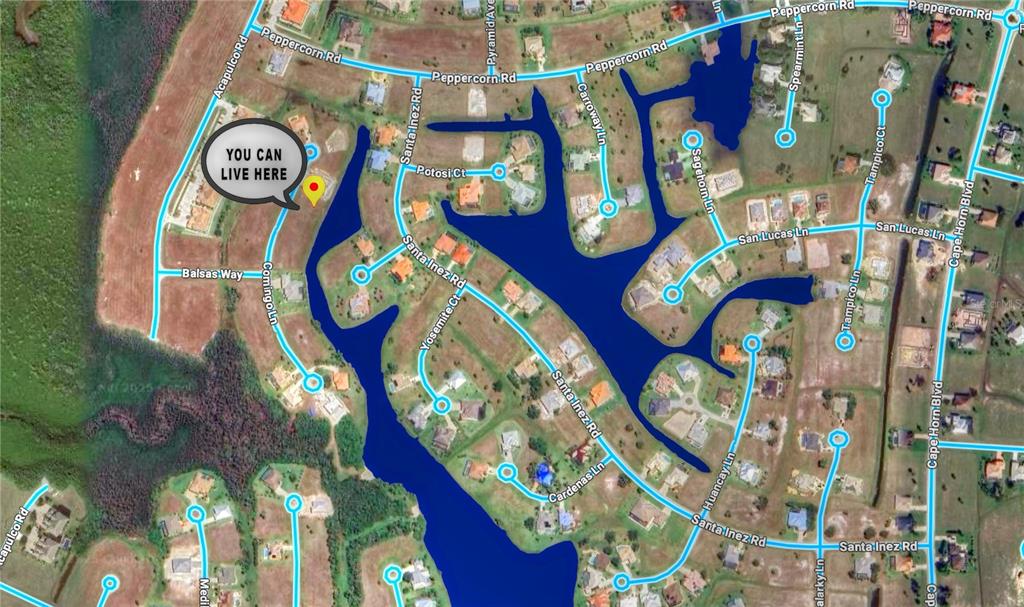 This is a satellite map view of a residential neighborhood with houses and water features — 17294 COMINGO LANE, PUNTA GORDA, FL