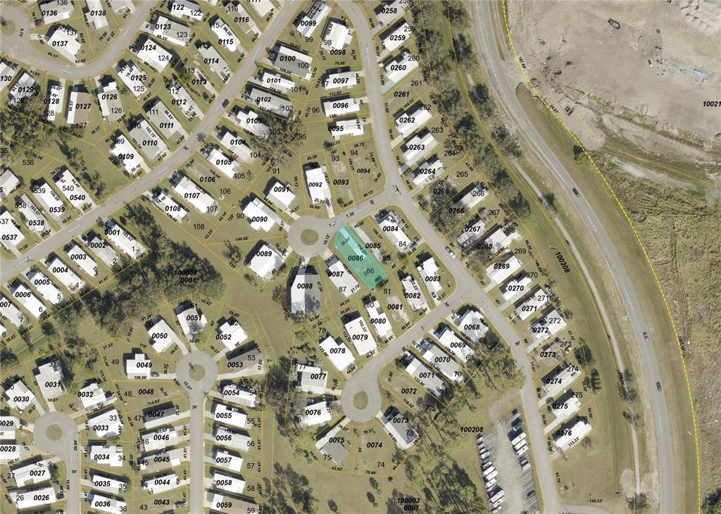 This is an aerial map showing a residential neighborhood with houses and cul-de-sacs — 6534 HONU (LOT 86) COURT, NORTH PORT, FL
