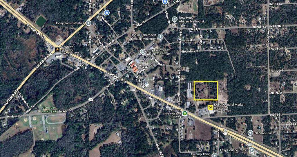 This is an aerial map showing a highlighted parcel of land in a rural town — TBD COMMERCE STREET, BRONSON, FL