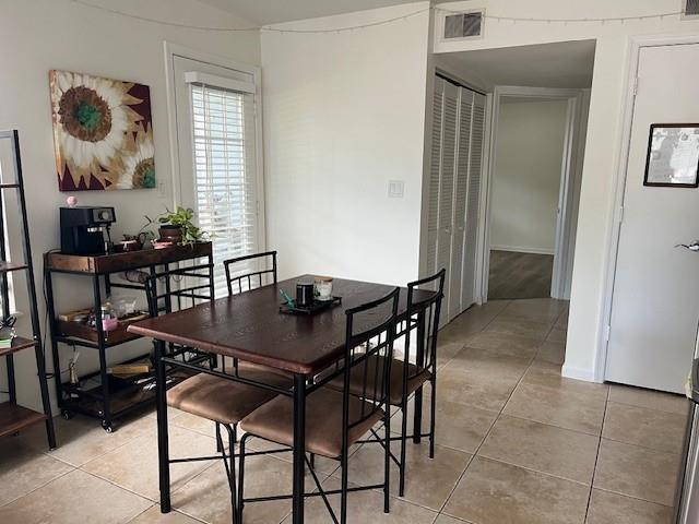 A dining area features a dark wood table with four chairs and a coffee cart — 1000 Crystal Way # A, Delray Beach FL 33444, DELRAY BEACH, FL